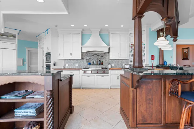 a kitchen with a sink and a large window