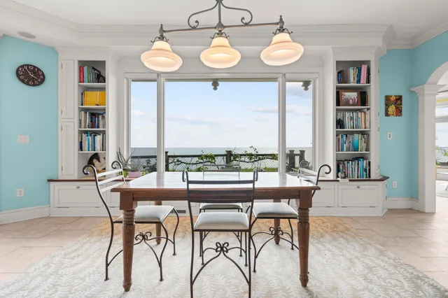 a view of a dining room with furniture window and outside view