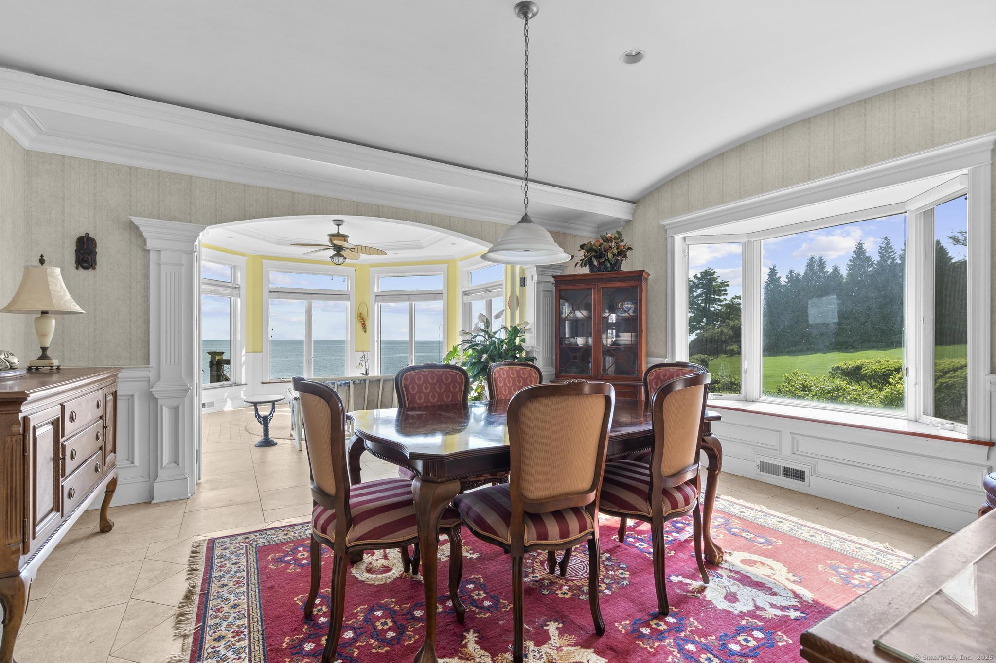 1410 South Pine Creek Road Fairfield, CT 06824 - Photo 38 of 40 a view of a dining room with furniture window and outside view