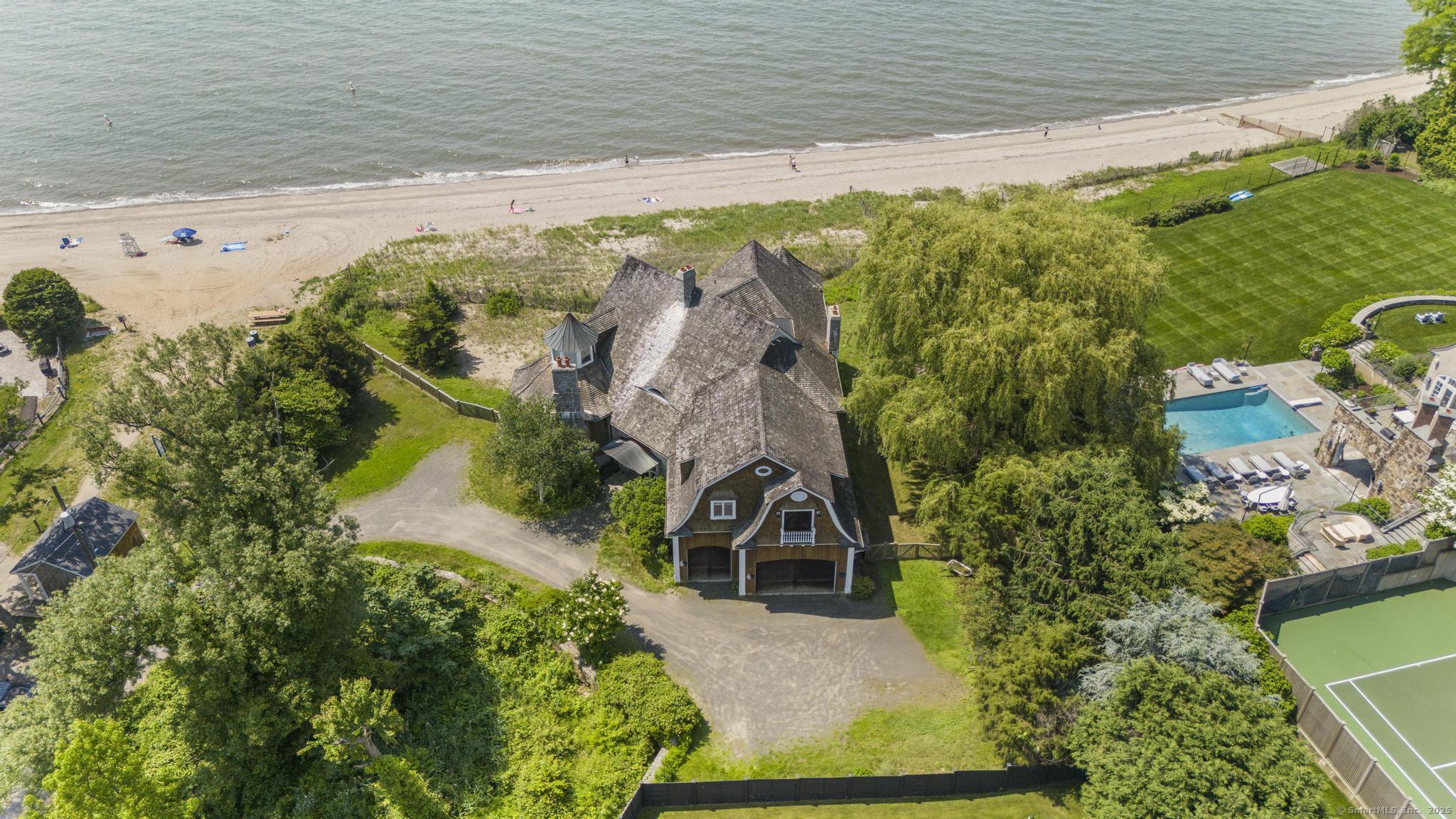 1410 South Pine Creek Road Fairfield, CT 06824 - Photo 5 of 40 a view of a lake with a building in the background