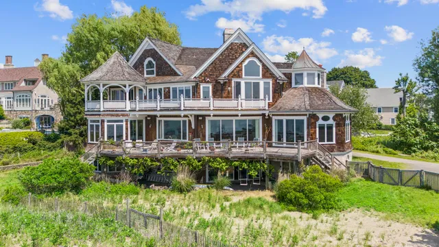 a front view of a house with a yard table and chairs