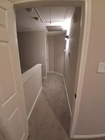 a view of hallway with stairs