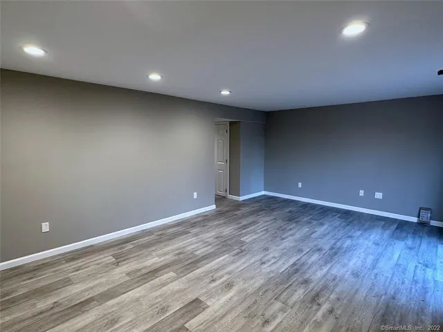 a view of room and wooden floor