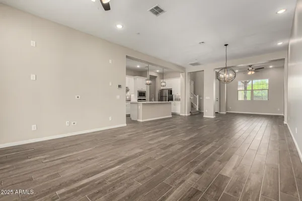 a front view of a sink and dishwasher with wooden floor