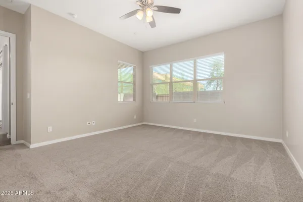 a view of a room with wooden floor and white cabinet