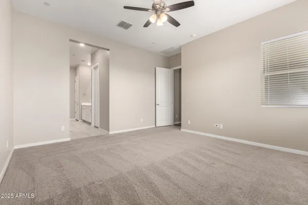 a spacious bathroom with a tub shower sink and mirror