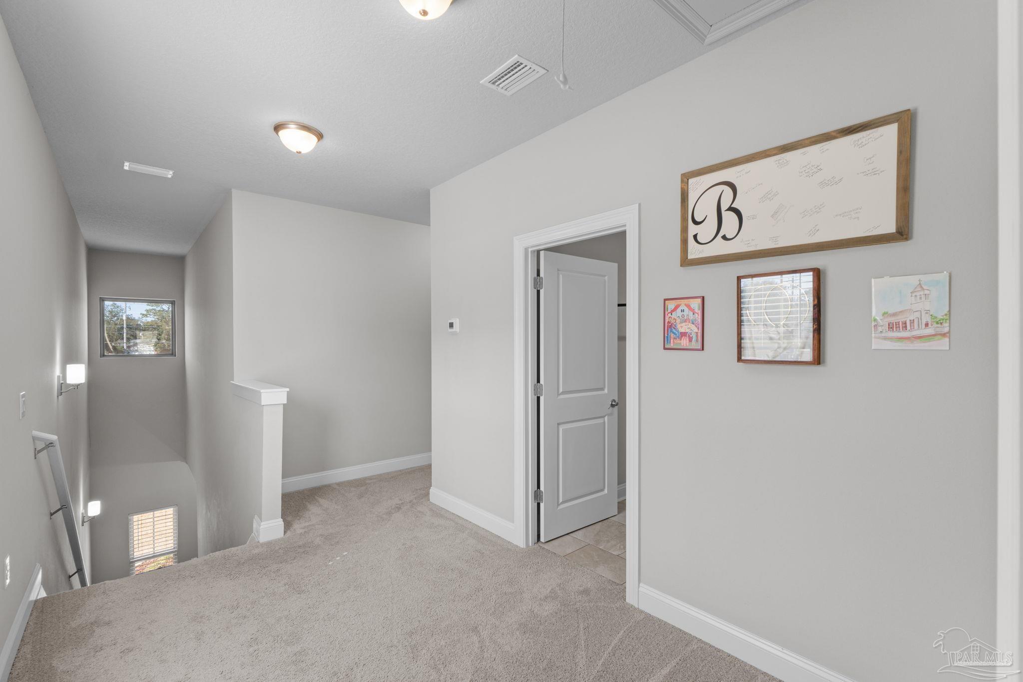 2770 Joe Pruitt Road Navarre, FL 32566 - Photo 22 of 58 a view of a hallway with bathroom