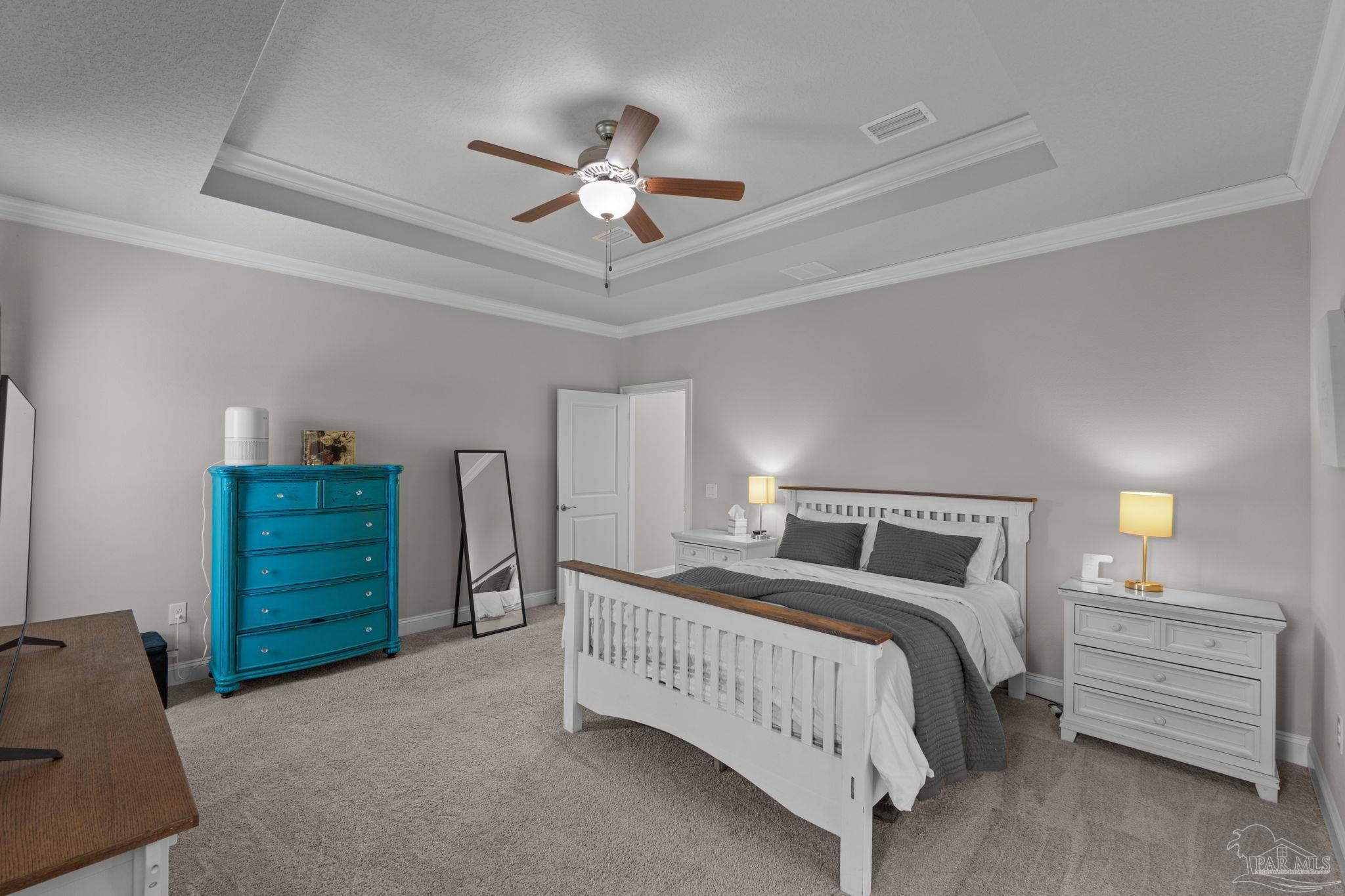 2770 Joe Pruitt Road Navarre, FL 32566 - Photo 25 of 58 a bedroom with a bed and a dresser