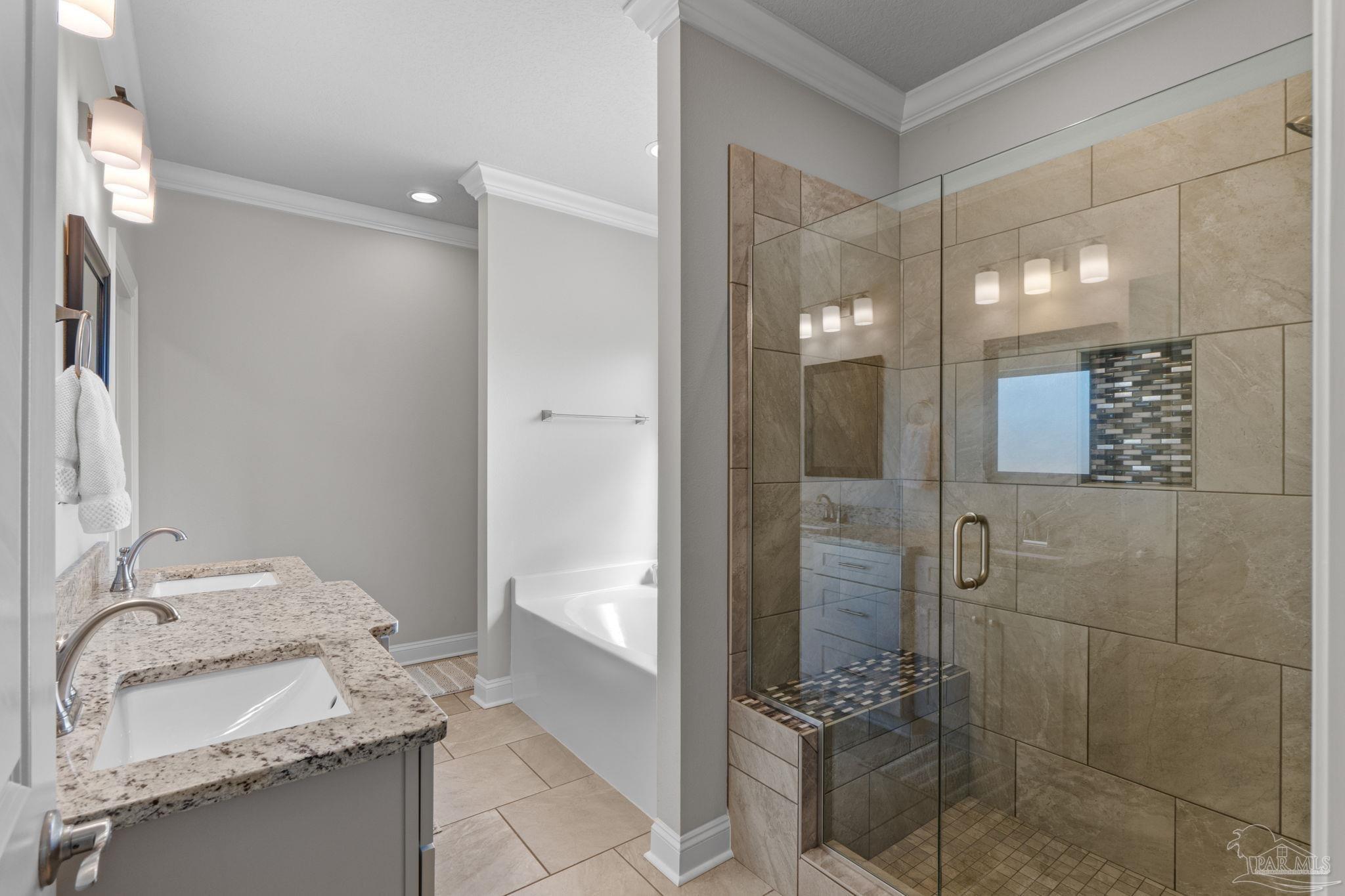 2770 Joe Pruitt Road Navarre, FL 32566 - Photo 26 of 58 a bathroom with a granite countertop sink a toilet and shower