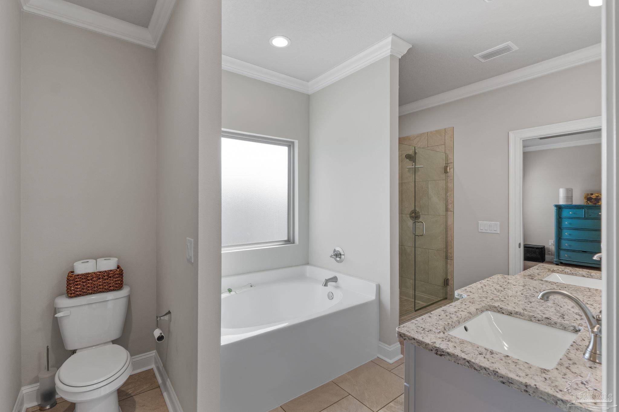 2770 Joe Pruitt Road Navarre, FL 32566 - Photo 28 of 58 a bathroom with a granite countertop sink a toilet and shower