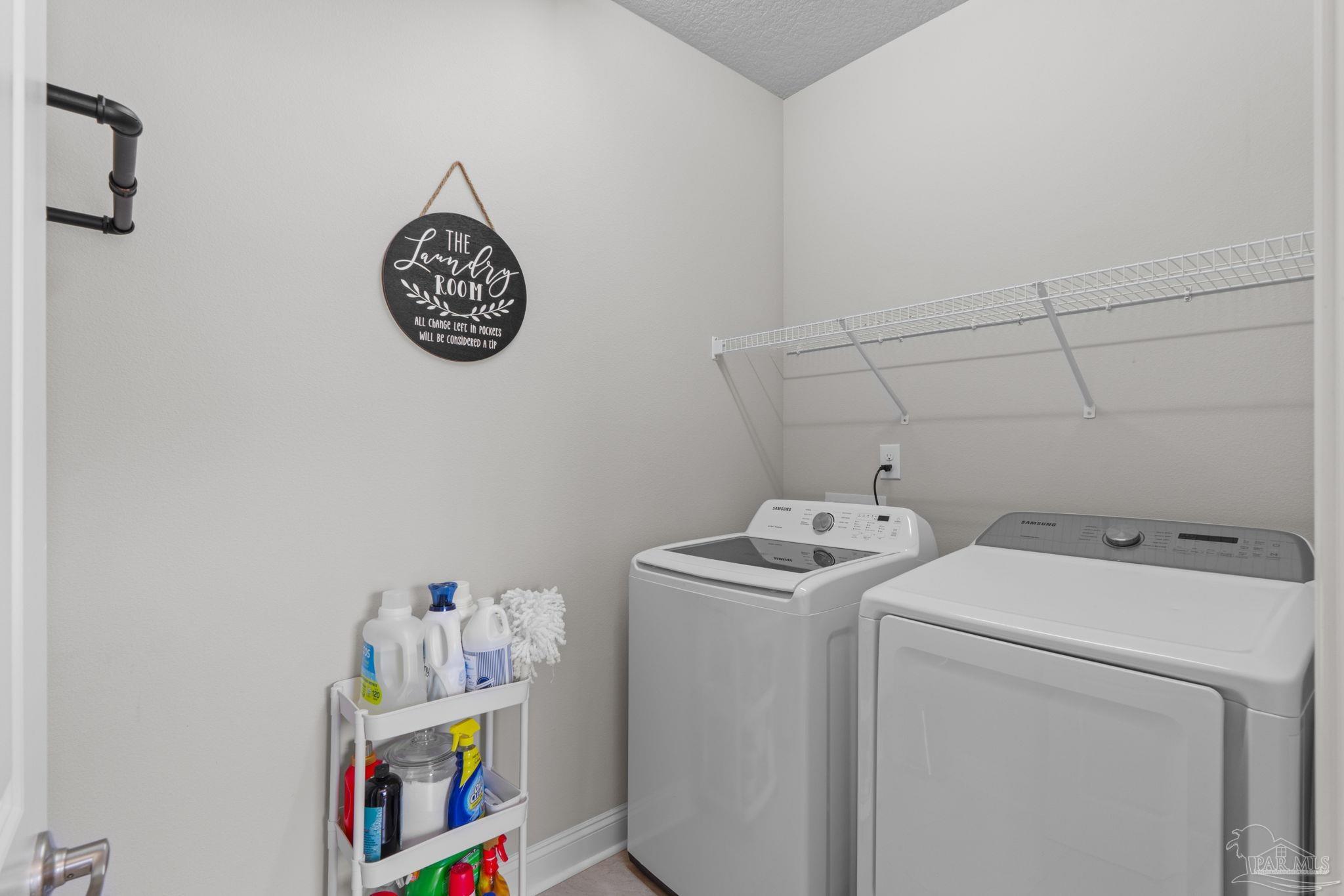 2770 Joe Pruitt Road Navarre, FL 32566 - Photo 32 of 58 a utility room with dryer and washer