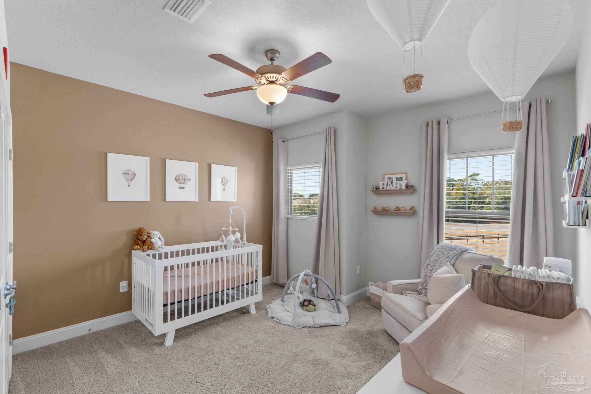 2770 Joe Pruitt Road Navarre, FL 32566 - Photo 35 of 58 a bedroom with furniture and windows