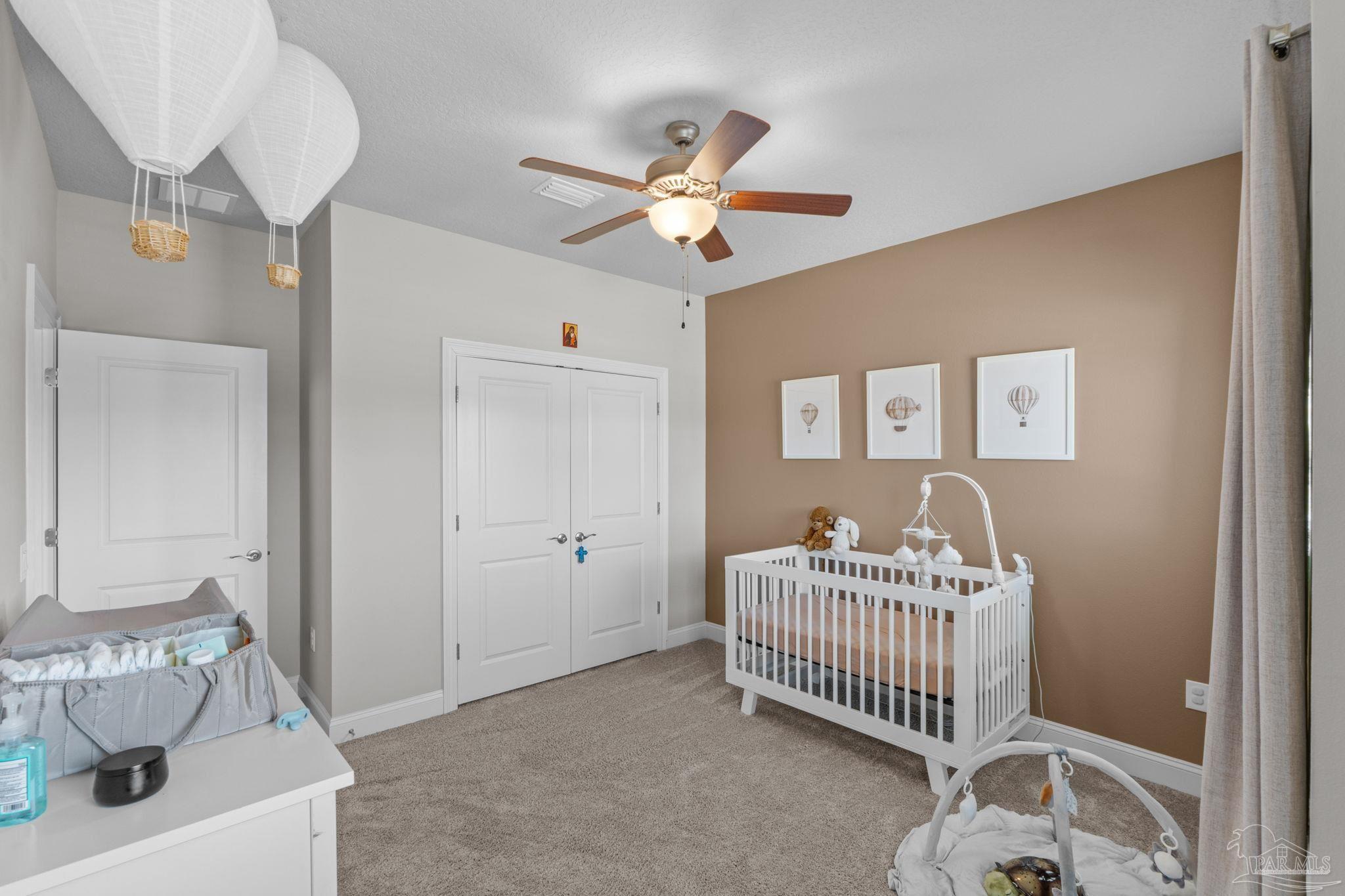 2770 Joe Pruitt Road Navarre, FL 32566 - Photo 36 of 58 a bedroom with a bed and a window