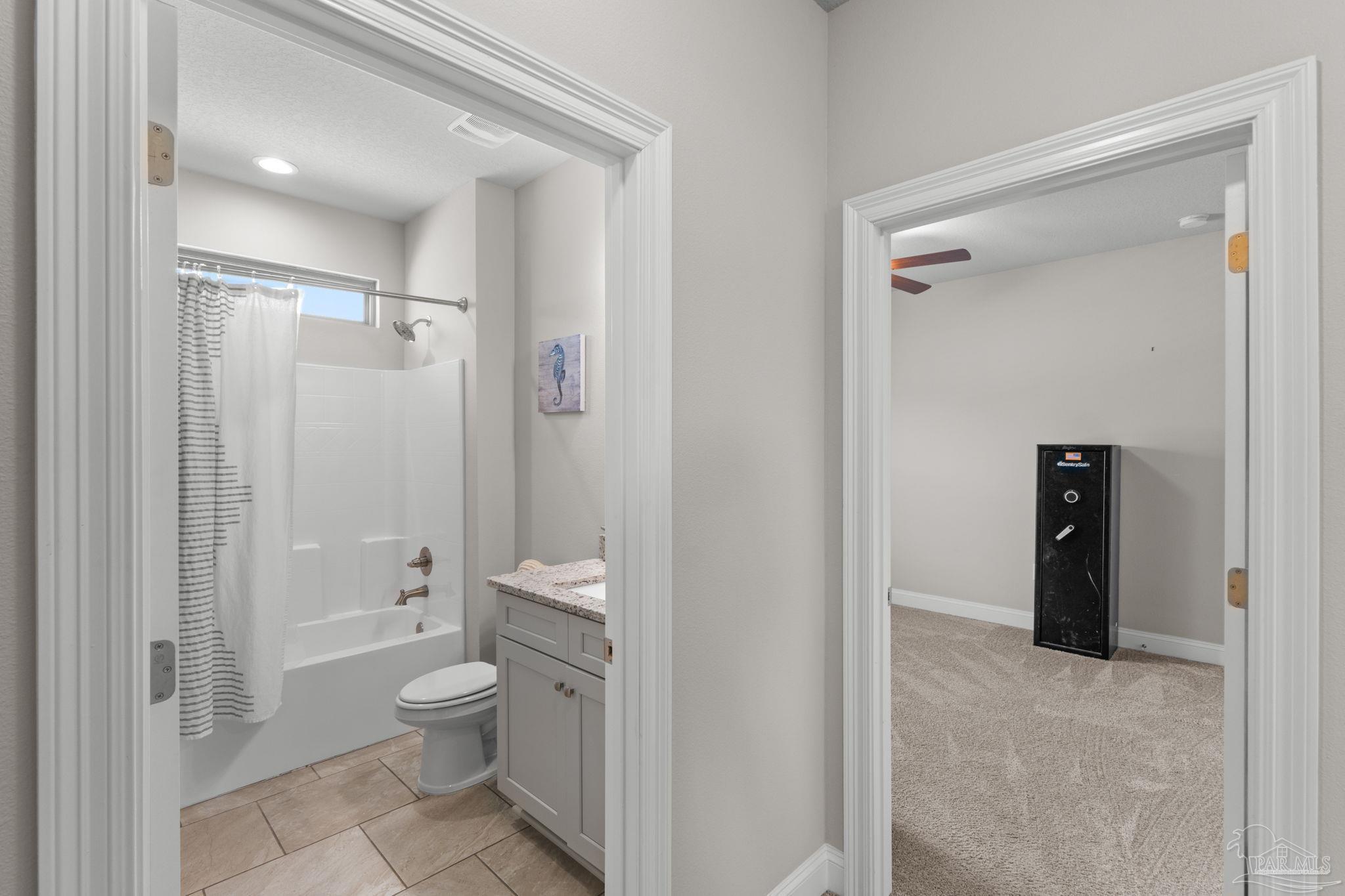 2770 Joe Pruitt Road Navarre, FL 32566 - Photo 39 of 58 a bathroom with a granite countertop toilet