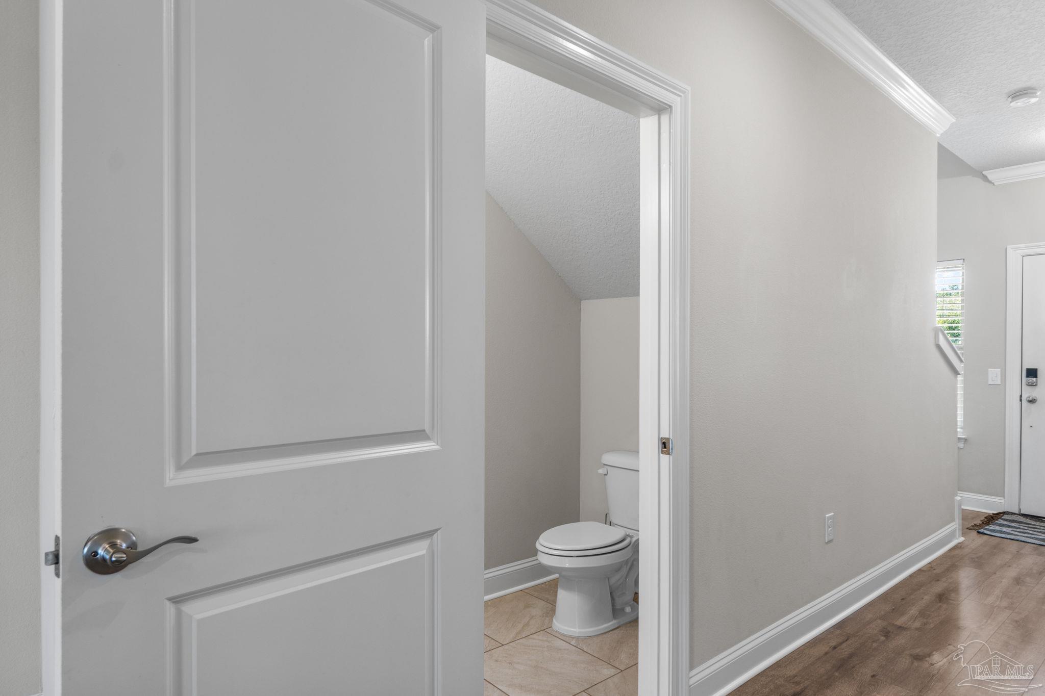 2770 Joe Pruitt Road Navarre, FL 32566 - Photo 42 of 58 a bathroom with a toilet