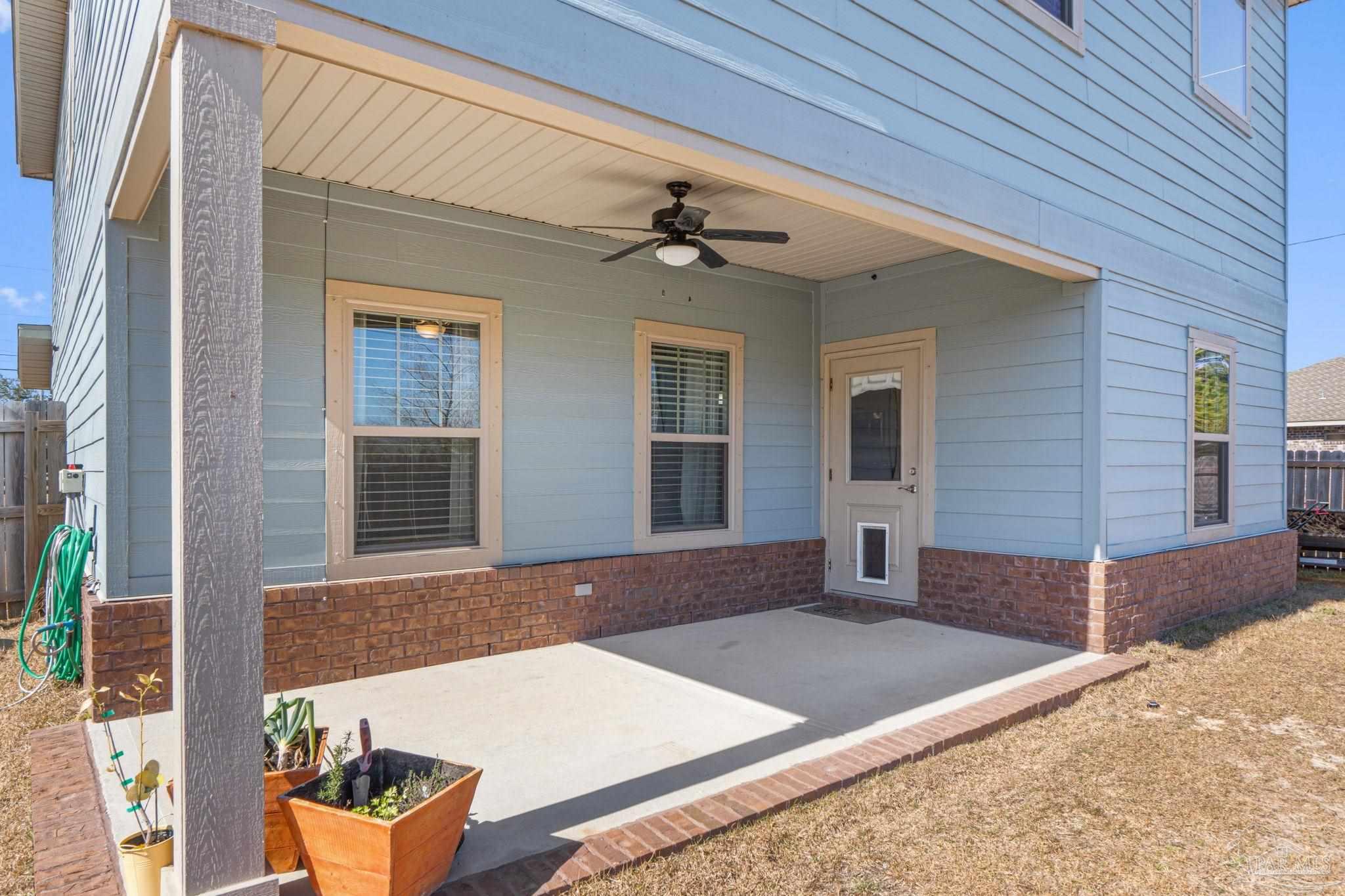 2770 Joe Pruitt Road Navarre, FL 32566 - Photo 45 of 58 a front view of a house with yard
