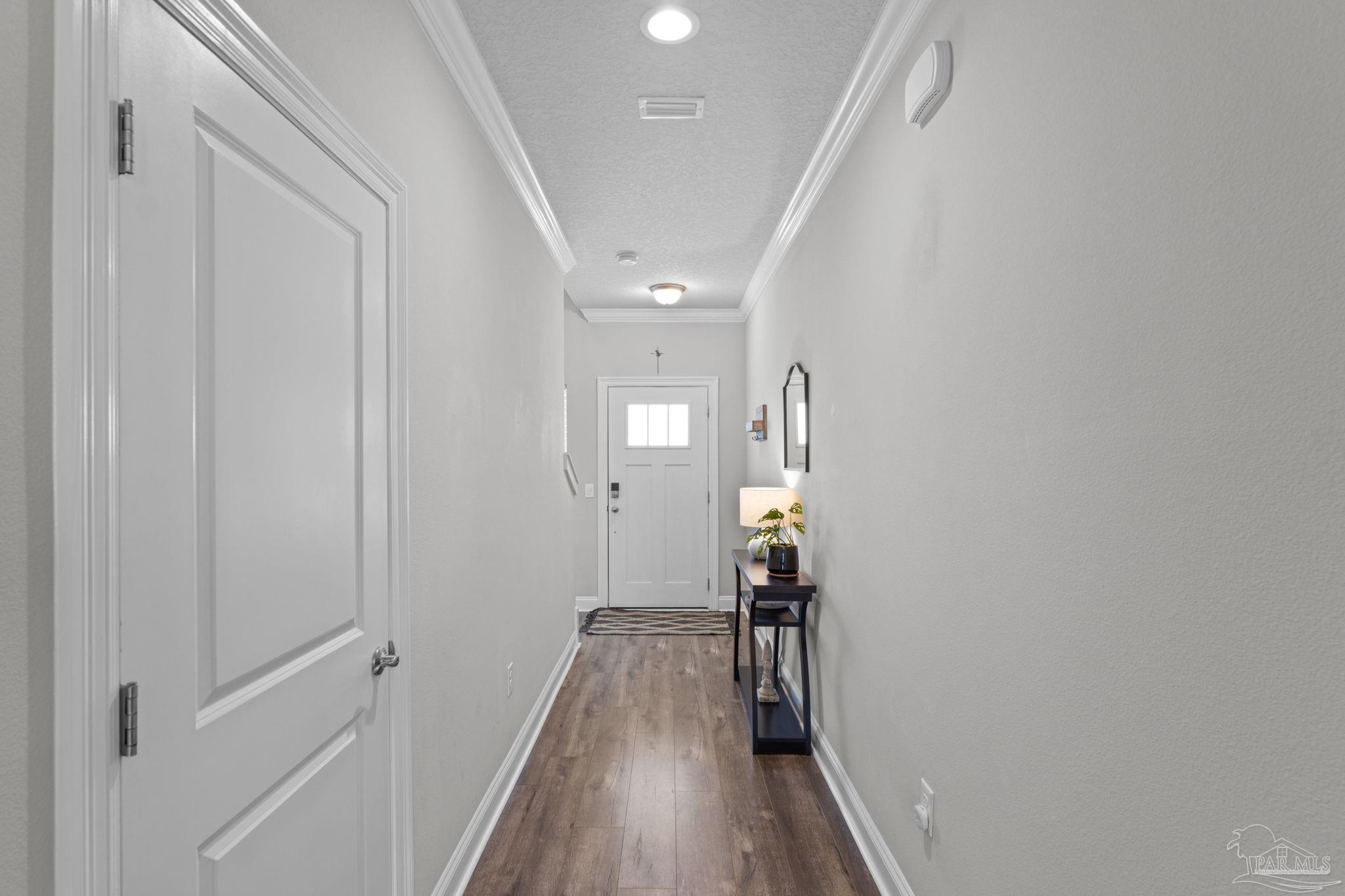 2770 Joe Pruitt Road Navarre, FL 32566 - Photo 5 of 58 a view of hallway with wooden floor