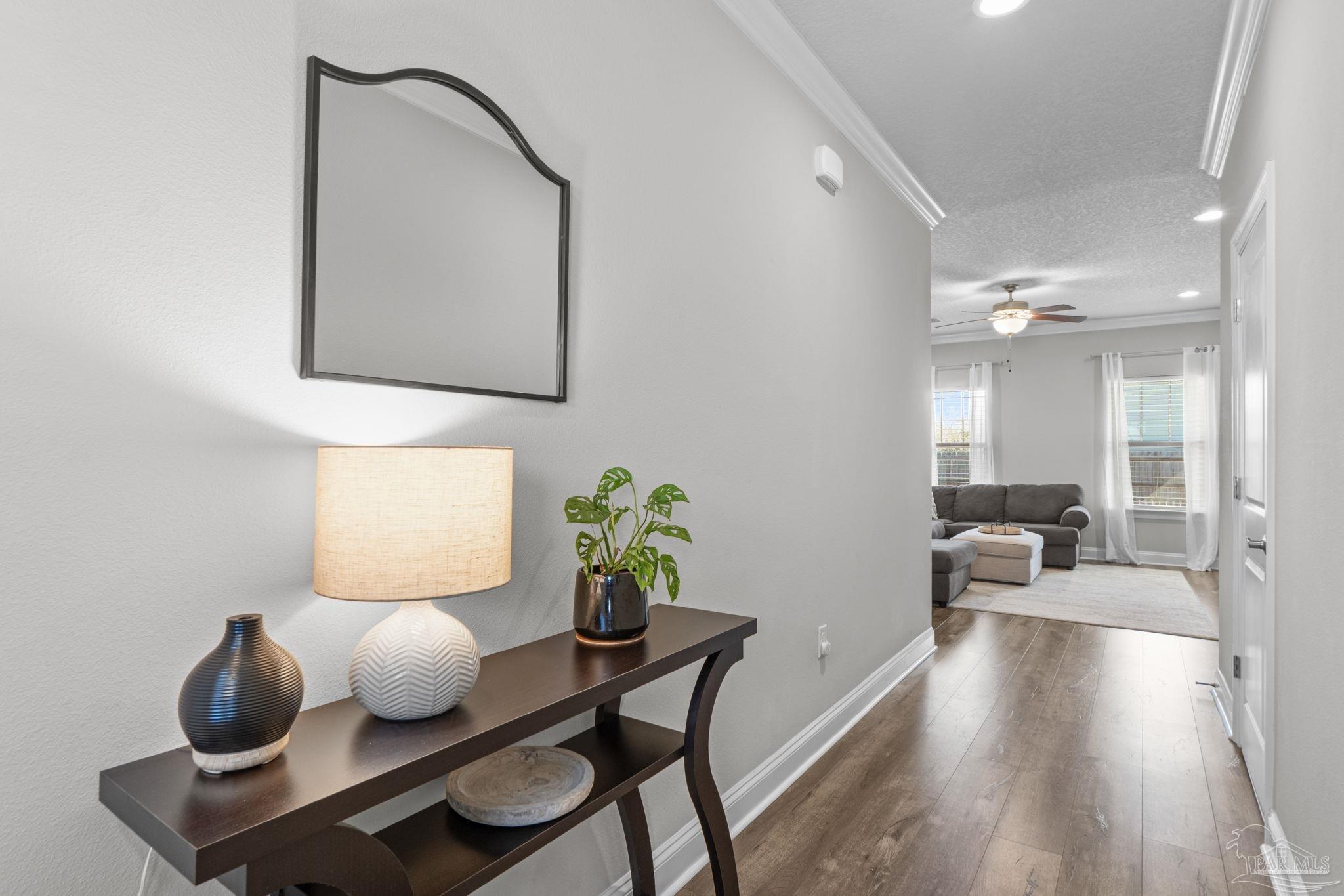 2770 Joe Pruitt Road Navarre, FL 32566 - Photo 6 of 58 a living room with furniture and wooden floor