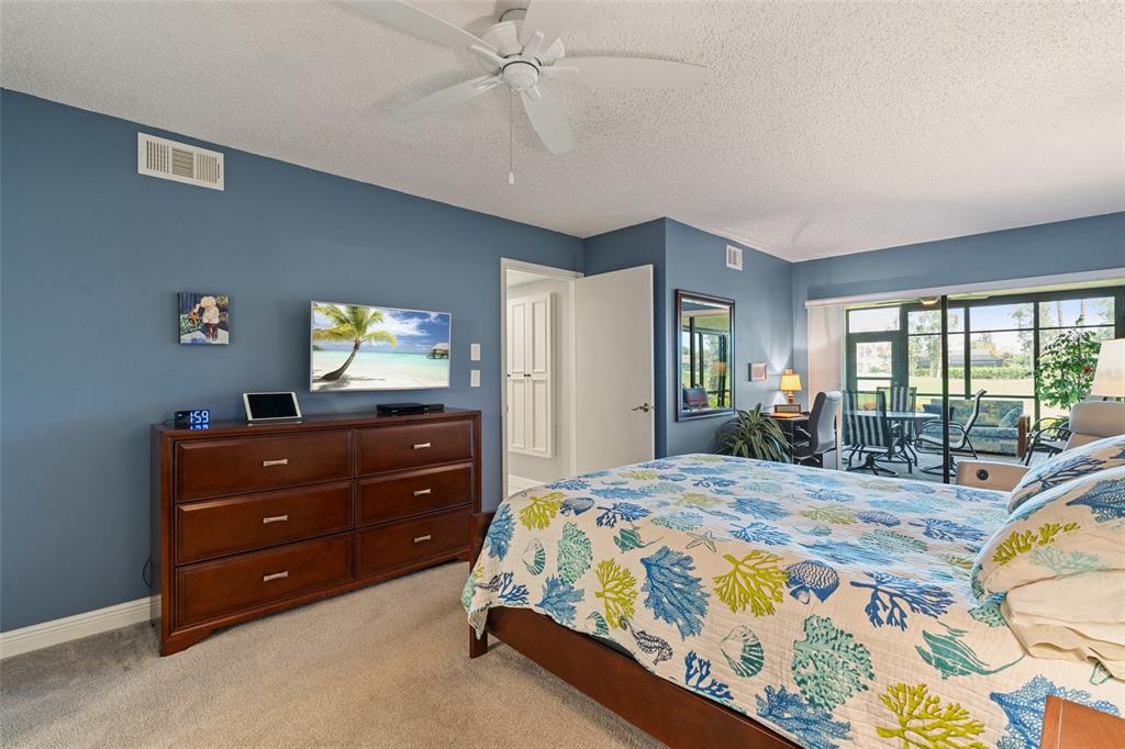 14770 Eagle Ridge Drive, Unit 112 Fort Myers, FL 33912 - Photo 11 of 32 a bedroom with a bed and a window