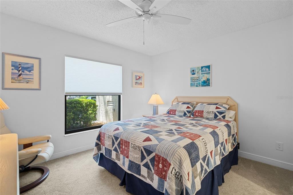 14770 Eagle Ridge Drive, Unit 112 Fort Myers, FL 33912 - Photo 15 of 32 a bedroom with a bed and window