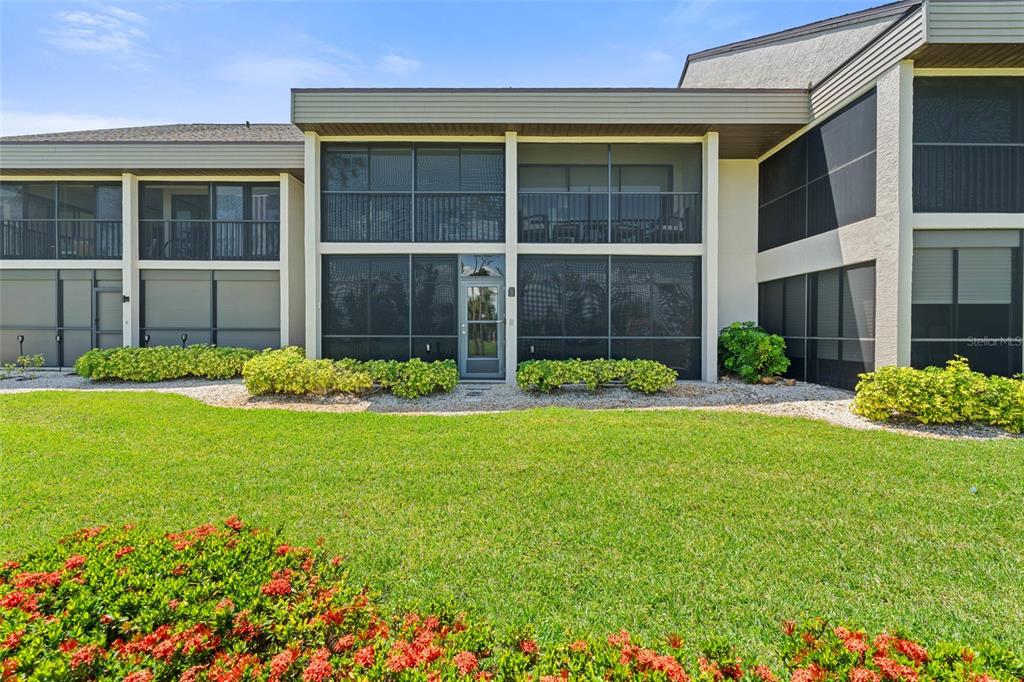 14770 Eagle Ridge Drive, Unit 112 Fort Myers, FL 33912 - Photo 22 of 32 a view of a house with a garden and plants