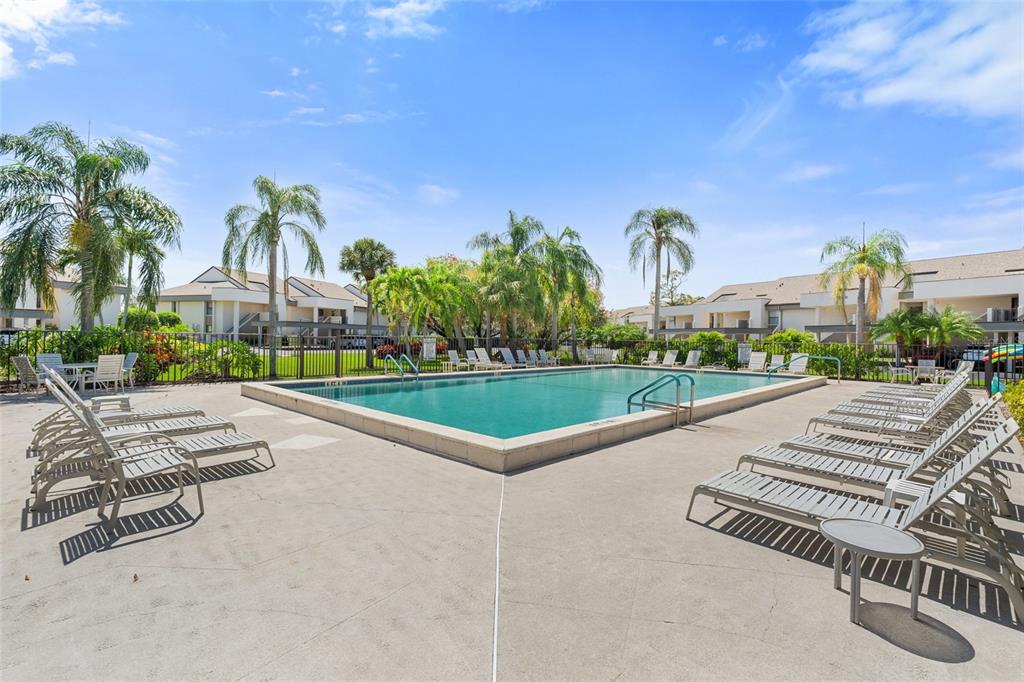 14770 Eagle Ridge Drive, Unit 112 Fort Myers, FL 33912 - Photo 26 of 32 a view of a city with tall buildings and a big yard