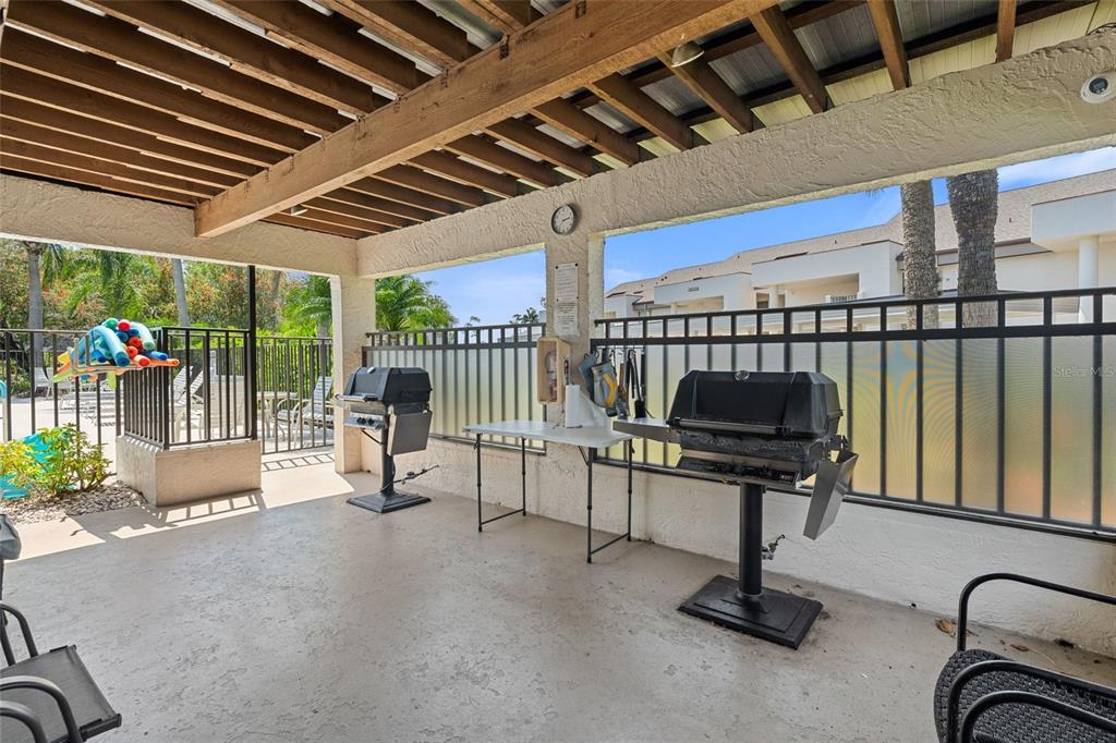 14770 Eagle Ridge Drive, Unit 112 Fort Myers, FL 33912 - Photo 27 of 32 a building outdoor space with patio furniture