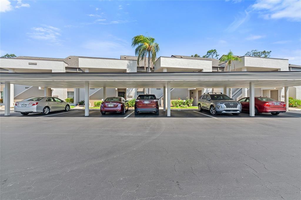 14770 Eagle Ridge Drive, Unit 112 Fort Myers, FL 33912 - Photo 28 of 32 a car parked in front of a building