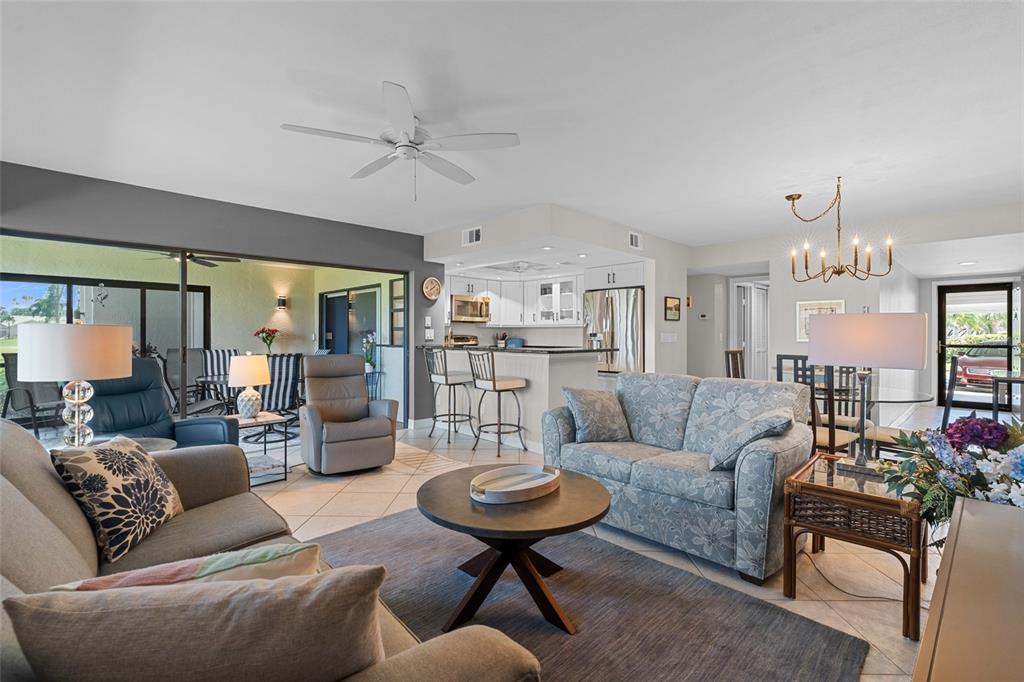 14770 Eagle Ridge Drive, Unit 112 Fort Myers, FL 33912 - Photo 4 of 32 a living room with furniture and a large window