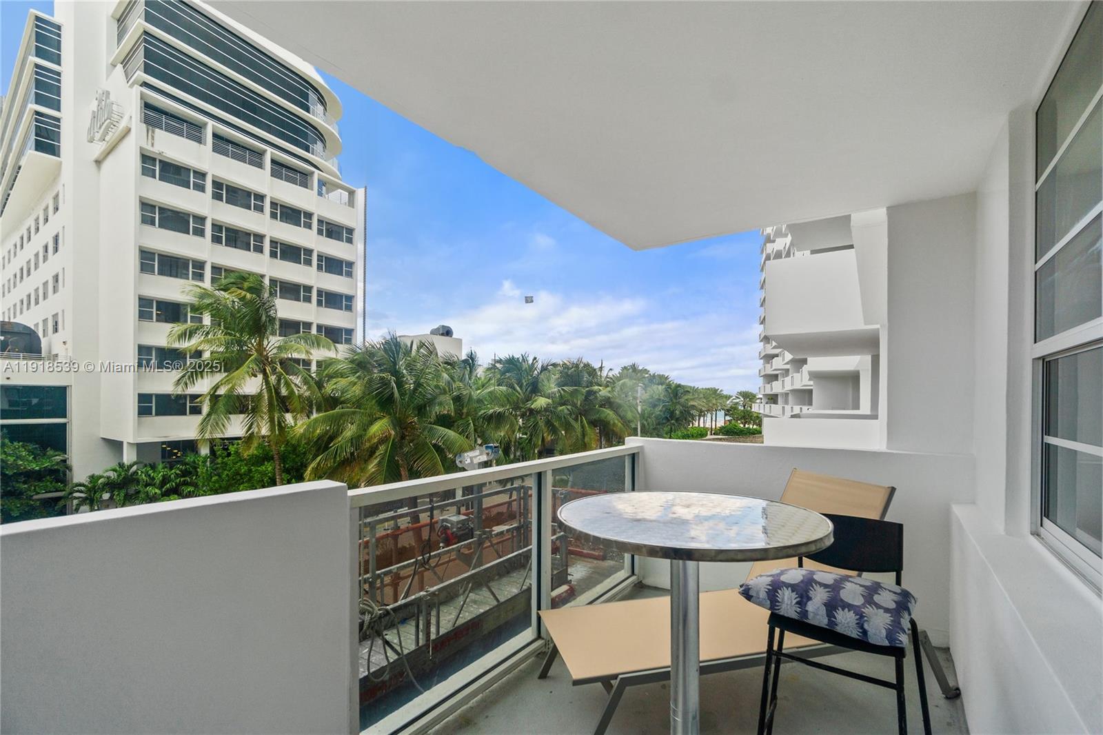 Miami Beach City Center Miami Beach, FL 33139 - Photo 2 of 15 a view of a chair and table in the balcony