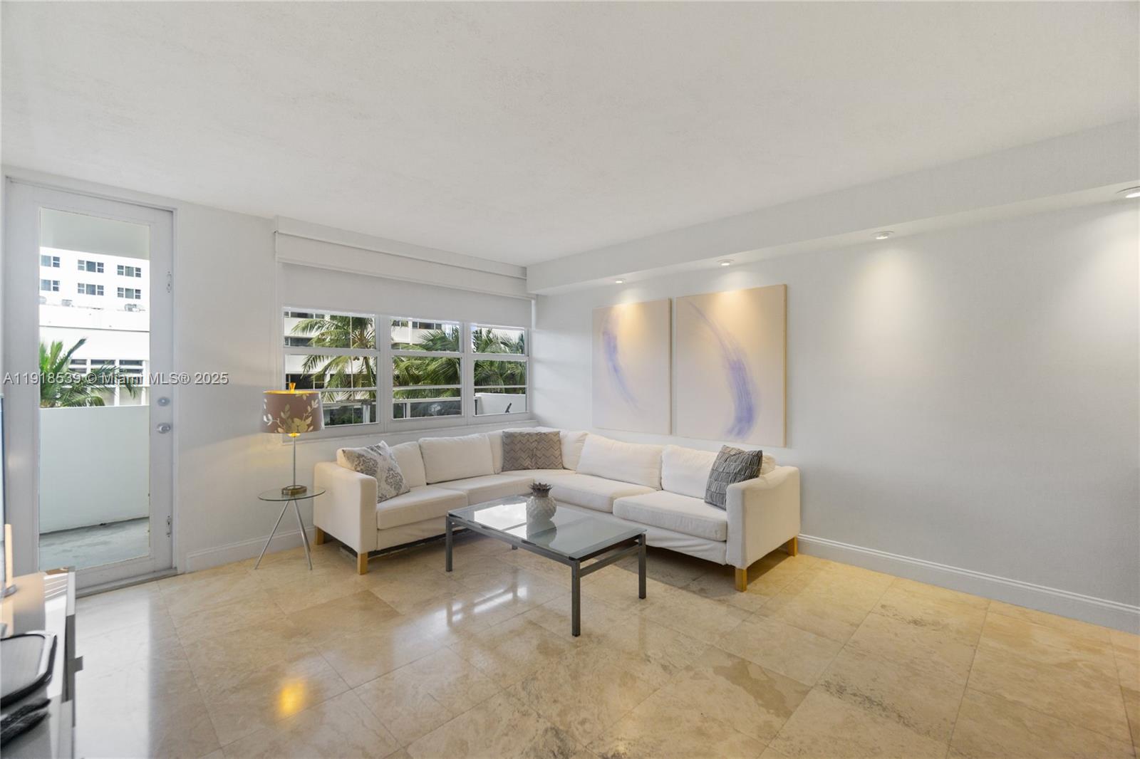 Miami Beach City Center Miami Beach, FL 33139 - Photo 5 of 15 a living room with furniture and a large window