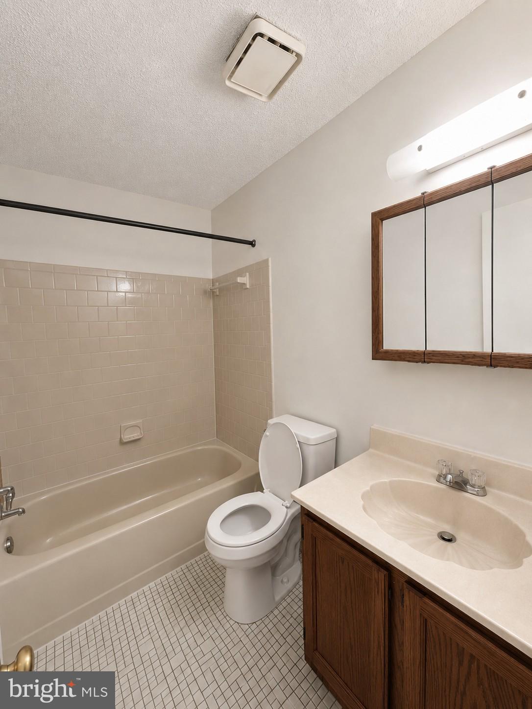 6204 Cipriano Road Lanham, MD 20706 - Photo 17 of 19 a bathroom with a sink toilet and shower