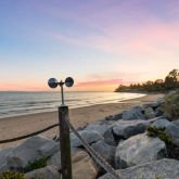 a view of a lake with a floor to ceiling window