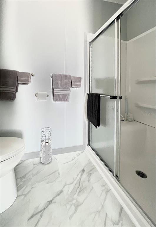 1100 South Belcher Road, Unit 512 Largo, FL 33771 - Photo 47 of 73 Primary bathroom shower/toilet combo