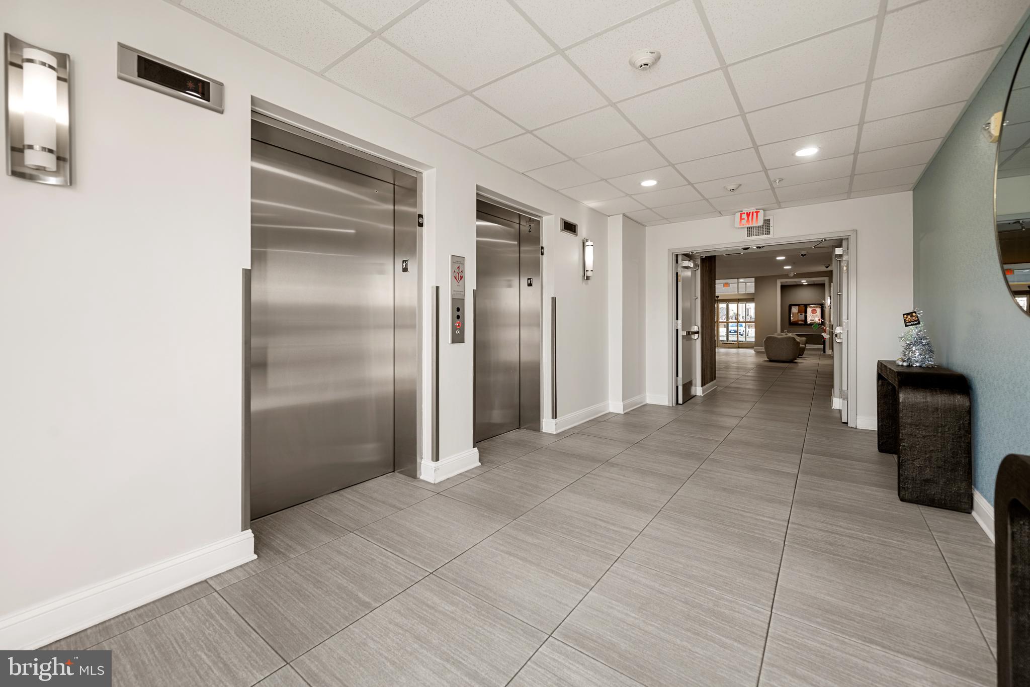 6301 Edsall Road, Unit 323 Alexandria, VA 22312 - Photo 18 of 27 a view of a hallway with wooden shelves