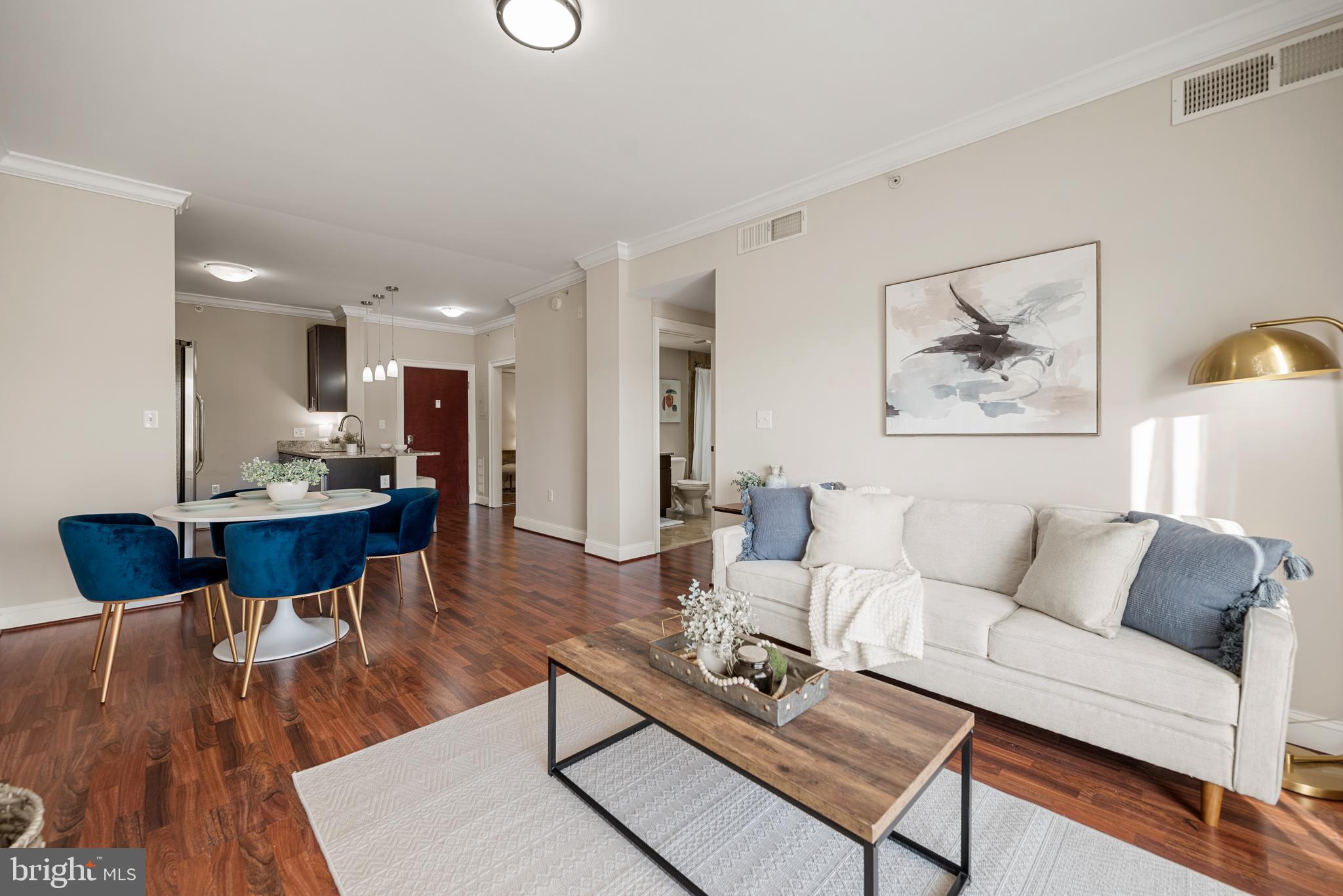 6301 Edsall Road, Unit 323 Alexandria, VA 22312 - Photo 2 of 27 a living room with furniture and a wooden floor