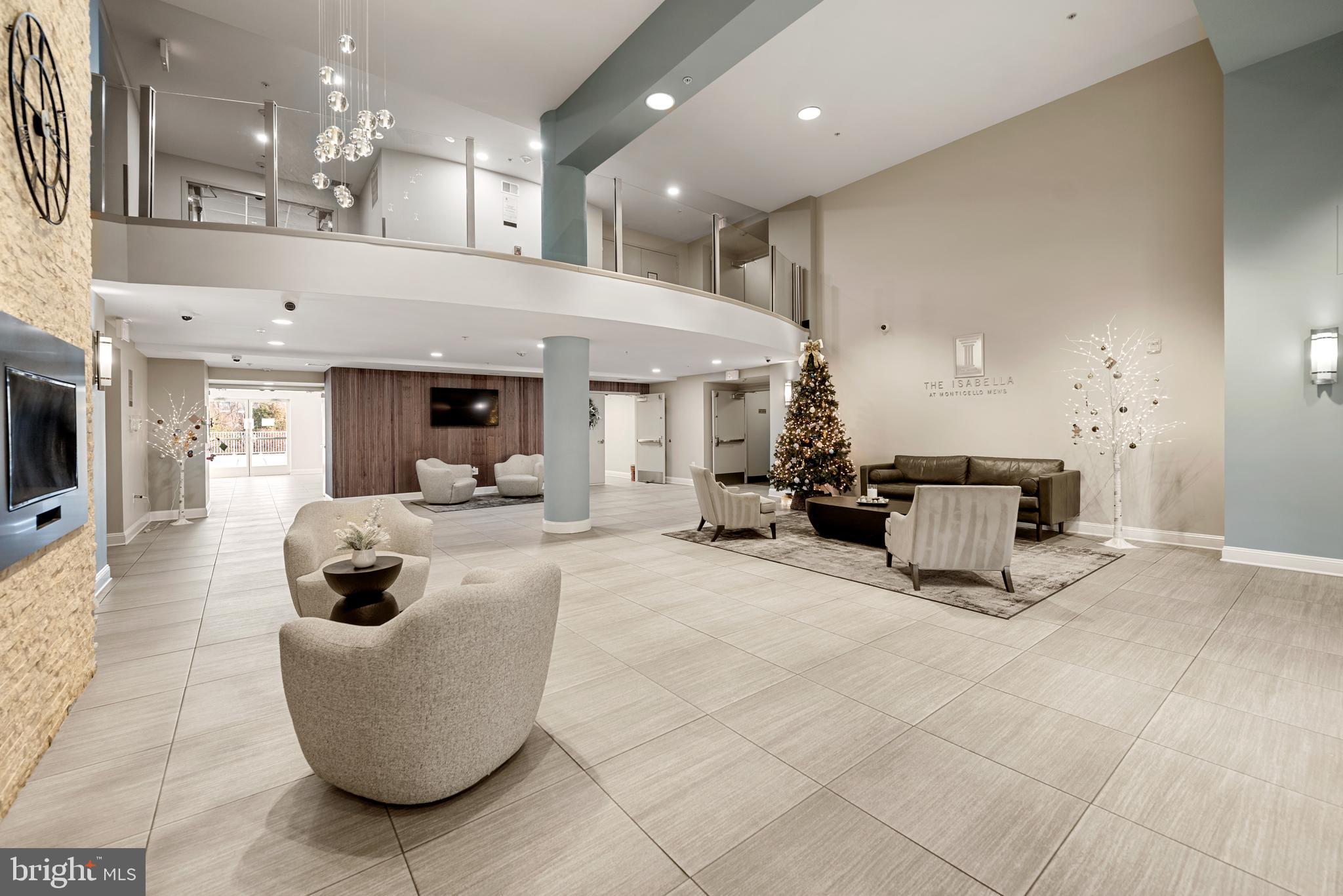 6301 Edsall Road, Unit 323 Alexandria, VA 22312 - Photo 20 of 27 a living room with furniture and a chandelier
