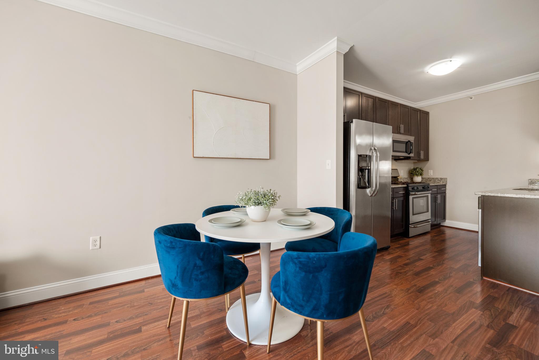 6301 Edsall Road, Unit 323 Alexandria, VA 22312 - Photo 4 of 27 a view of a dining room with furniture and wooden floor