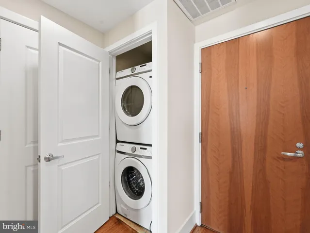a view of a hallway with washer and dryer