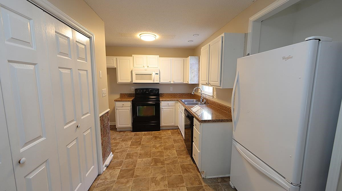 Freshly painted and has niche built in for backpacks/bags off the side porch entry Kitchen