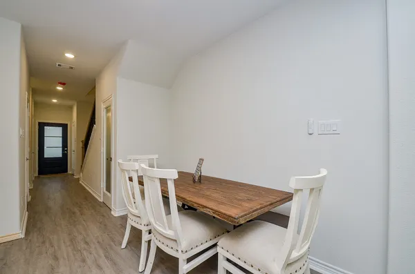 a workspace with furniture and wooden floor