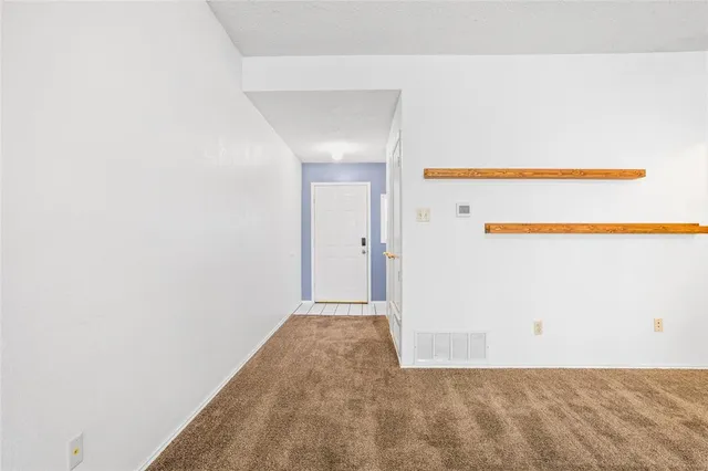 a view of a room with an empty space