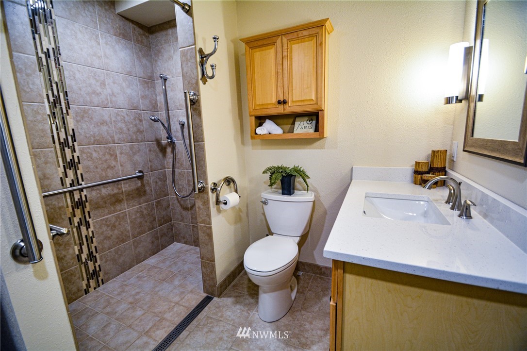23920 Brier Road Brier, WA 98036 - Photo 7 of 23 a bathroom with a sink toilet and shower