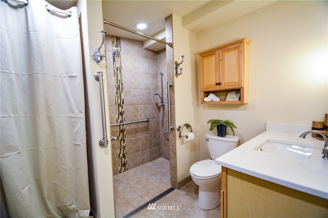 23920 Brier Road Brier, WA 98036 - Photo 8 of 23 a bathroom with a sink toilet and shower