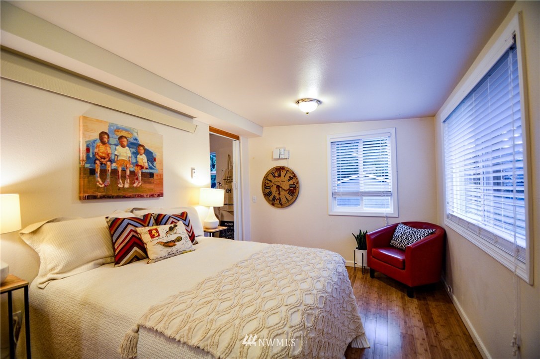 23920 Brier Road Brier, WA 98036 - Photo 9 of 23 a bedroom with a bed and a couch
