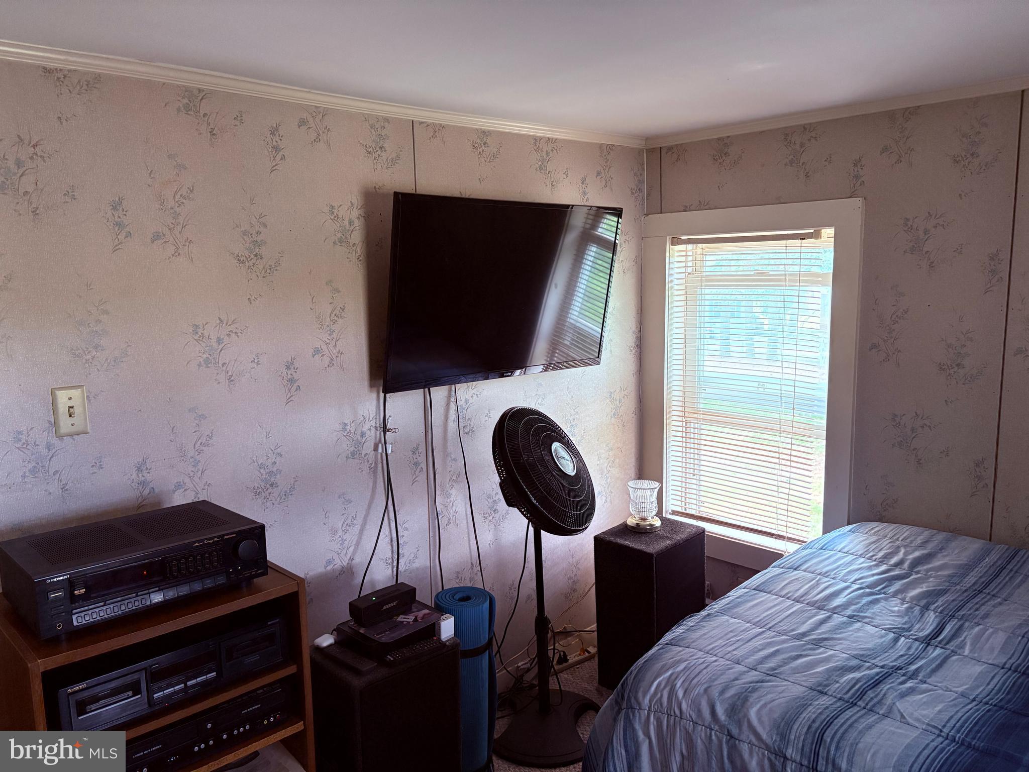 31867 Shavox Road Salisbury, MD 21804 - Photo 20 of 64 a bedroom with a bed and a flat tv screen