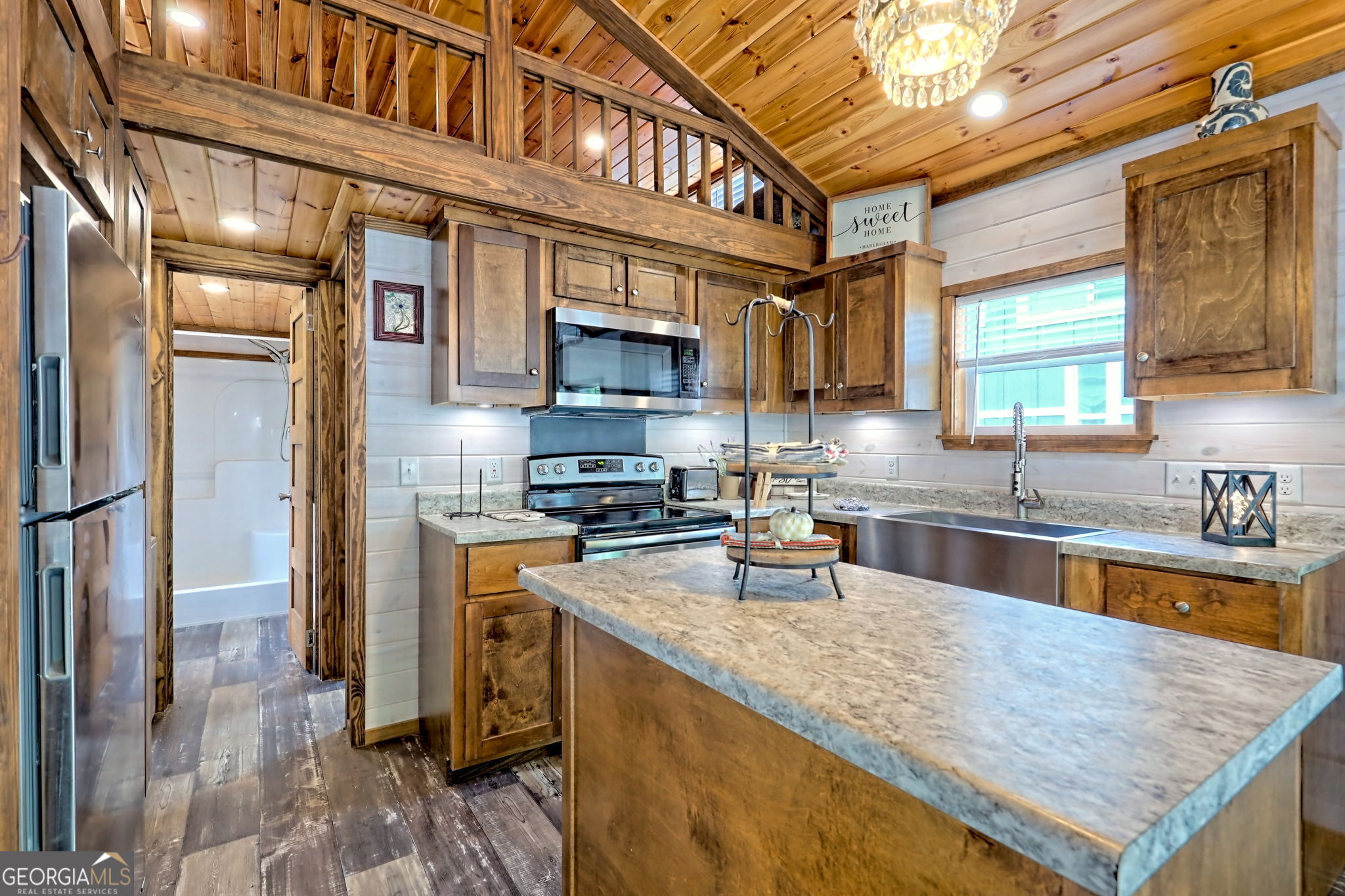 4960 Laurel Lodge Road Clarkesville, GA 30523 - Photo 11 of 29 a kitchen with stainless steel appliances granite countertop a sink a stove and a refrigerator