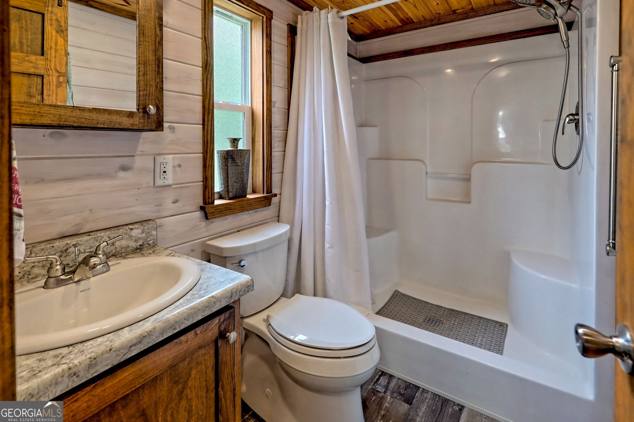 4960 Laurel Lodge Road Clarkesville, GA 30523 - Photo 15 of 29 a bathroom with a sink a toilet and shower