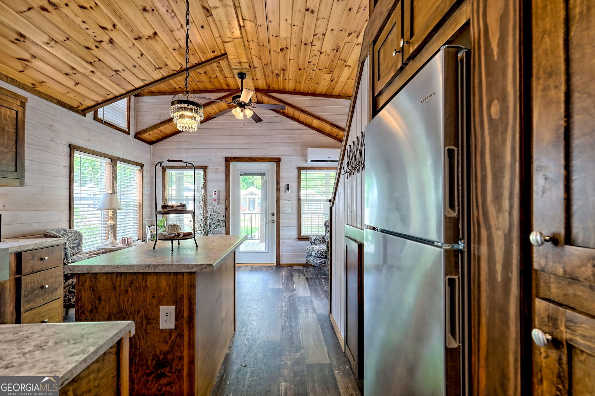 4960 Laurel Lodge Road Clarkesville, GA 30523 - Photo 18 of 29 a kitchen with stainless steel appliances granite countertop a refrigerator a stove and a sink with cabinets