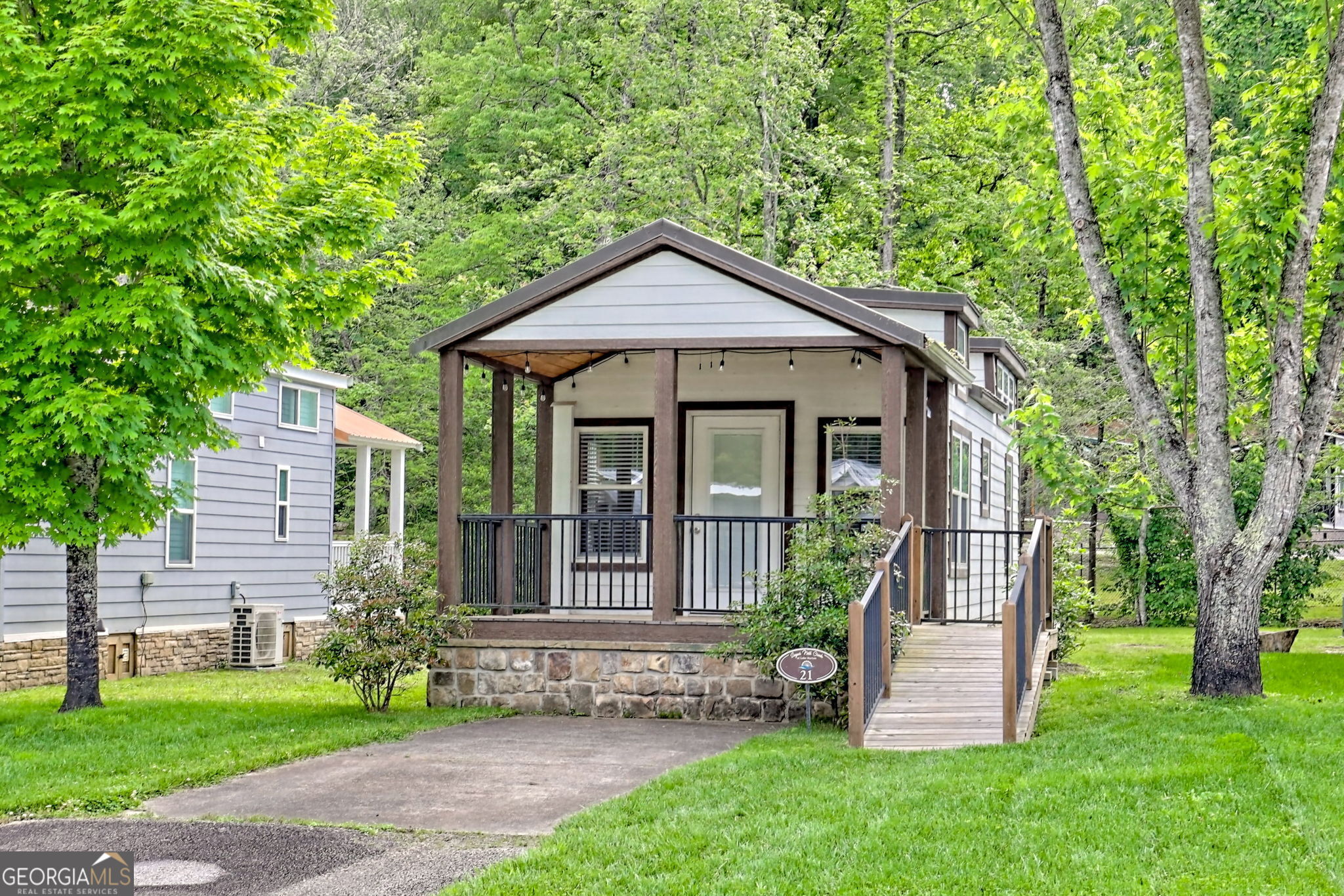 4960 Laurel Lodge Road Clarkesville, GA 30523 - Photo 2 of 29 a view of a house with a yard and plants